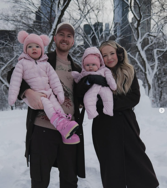 Kay and Tay with their family in the snow